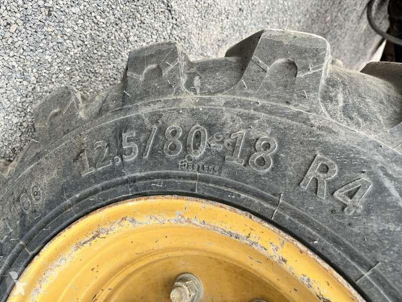 Traktor med grab Caterpillar