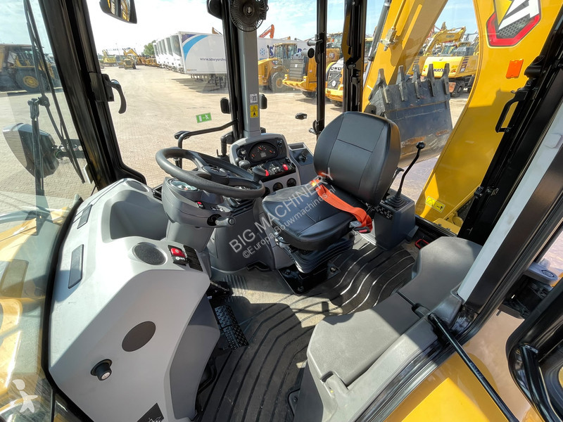 Traktor med grab Caterpillar 424
