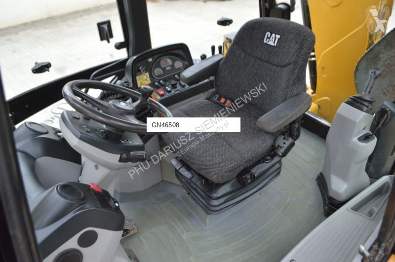 Traktor med grab Caterpillar