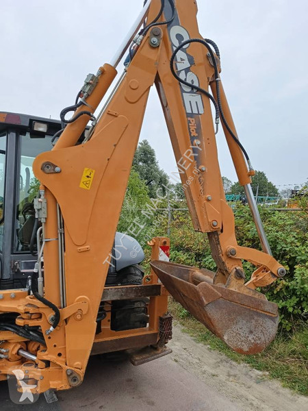 Traktor med grab Case backhoe loader graaf laad...