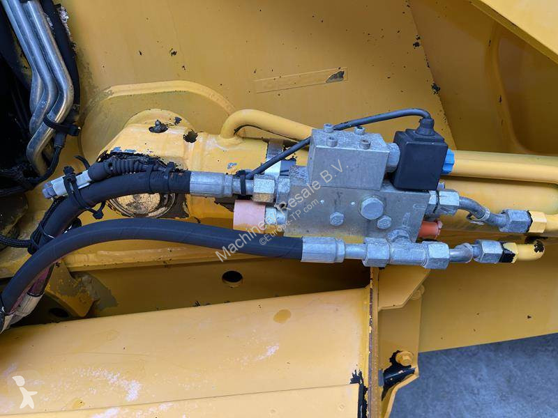 Traktor med grab Caterpillar