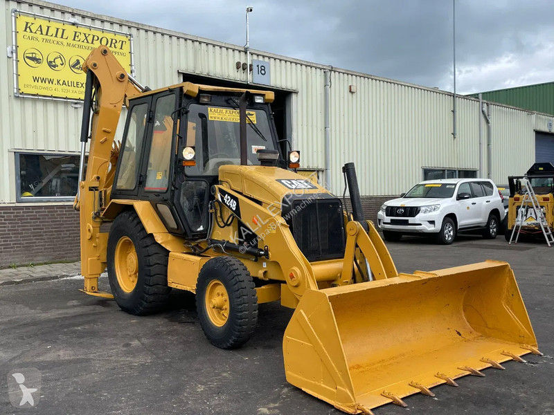 Traktor med grab Caterpillar 424B Backhoe...