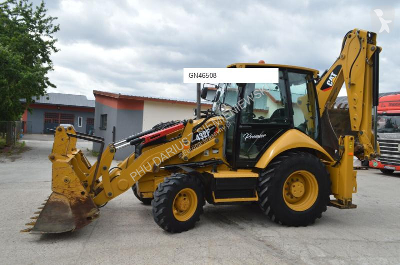 Traktor med grab Caterpillar