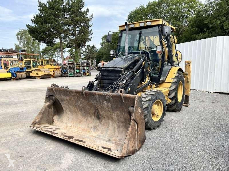 Traktor med grab Caterpillar