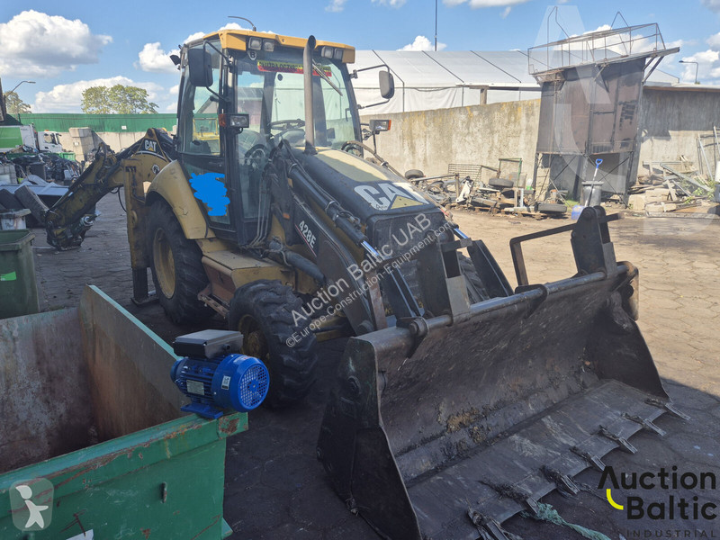 Екскаватор навантажувач Caterpillar