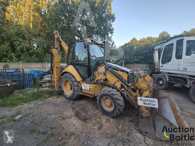 Екскаватор навантажувач Caterpillar