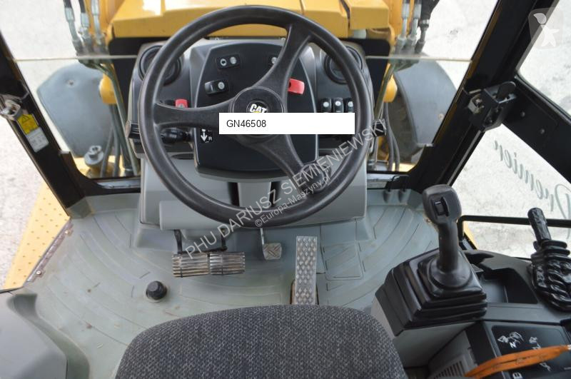 Traktor med grab Caterpillar