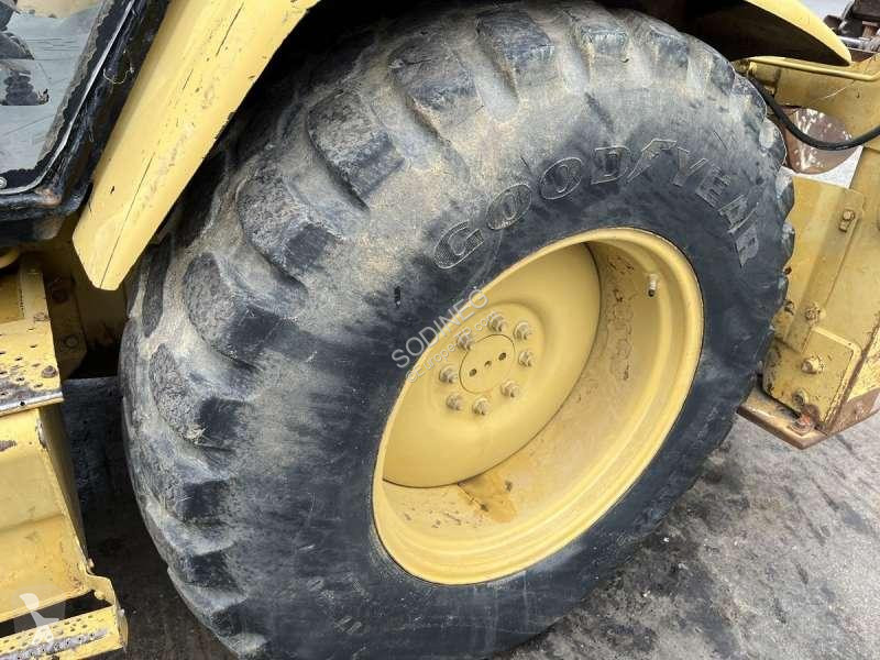 Traktor med grab Caterpillar