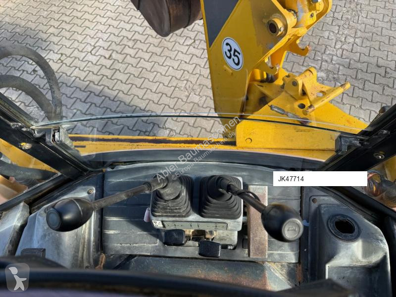 Traktor med grab Komatsu