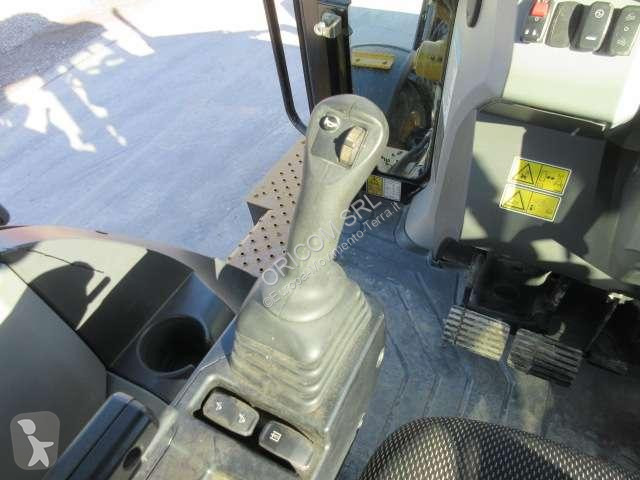 Traktor med grab Caterpillar 432
