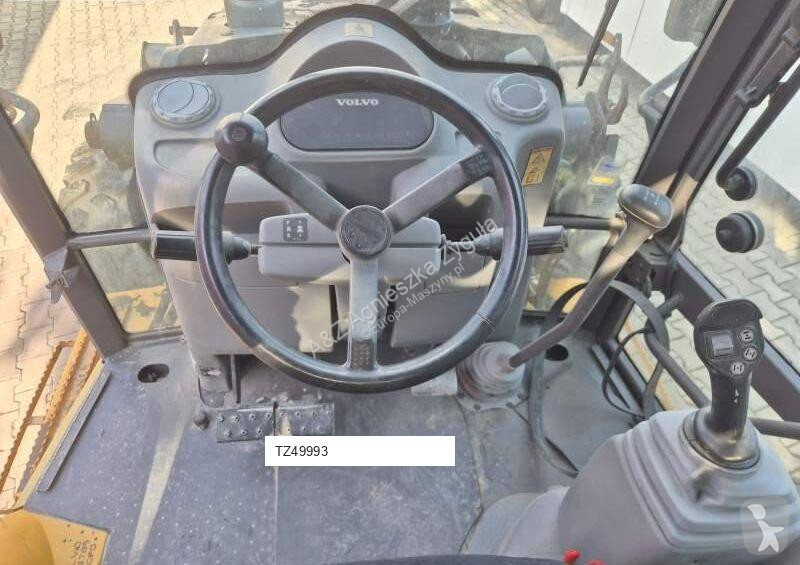 Traktor med grab Volvo