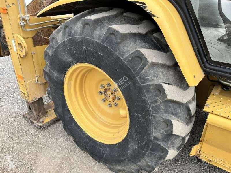 Traktor med grab Caterpillar