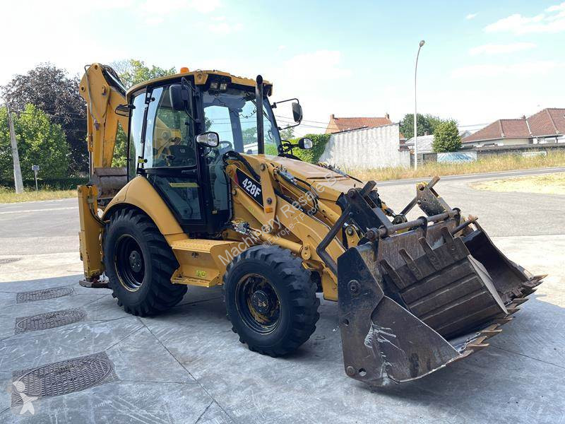 Traktor med grab Caterpillar