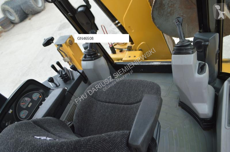 Traktor med grab Caterpillar