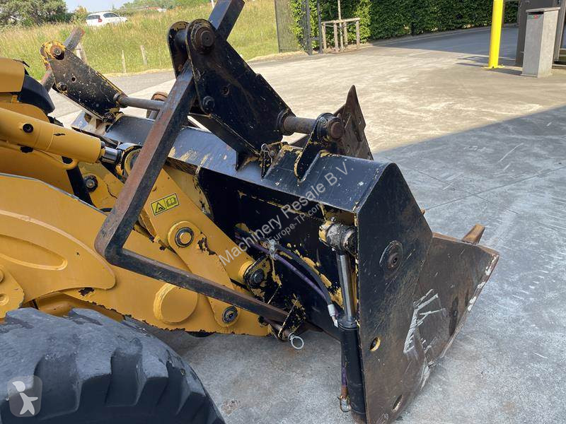 Traktor med grab Caterpillar