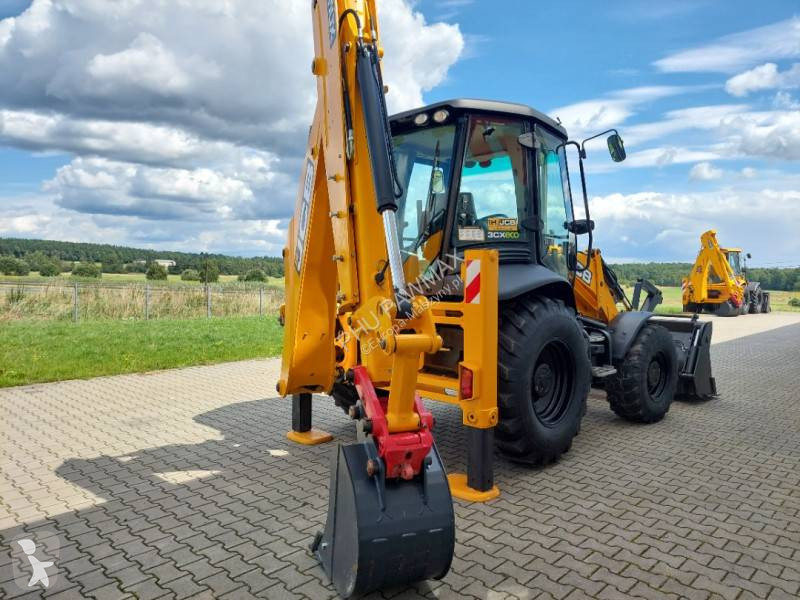 Traktor med grab JCB