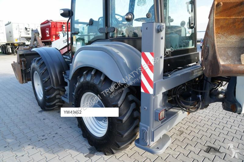Traktor med grab Terex TLB 990