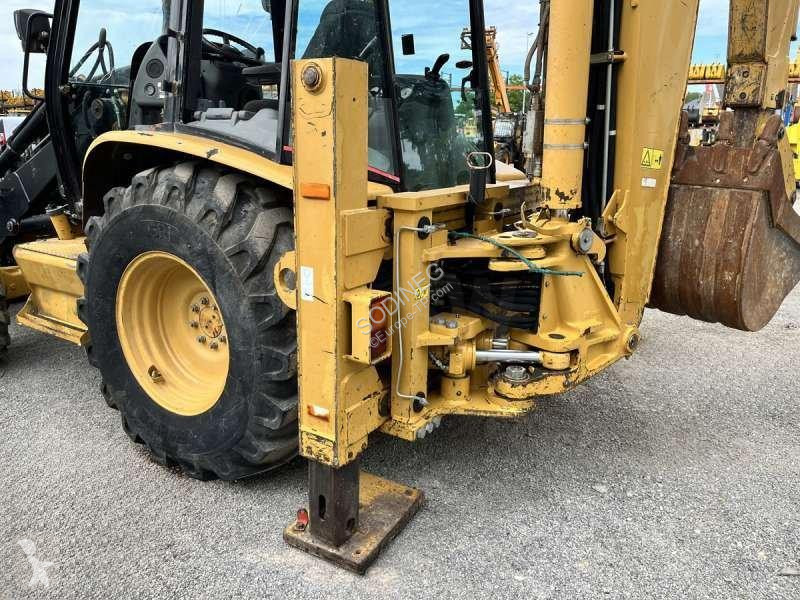Traktor med grab Caterpillar