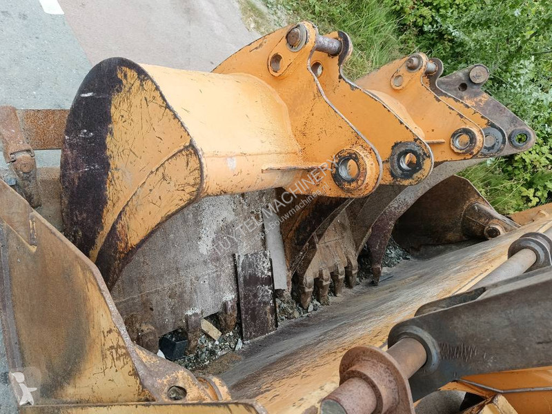 Traktor med grab Case backhoe loader graaf laad...