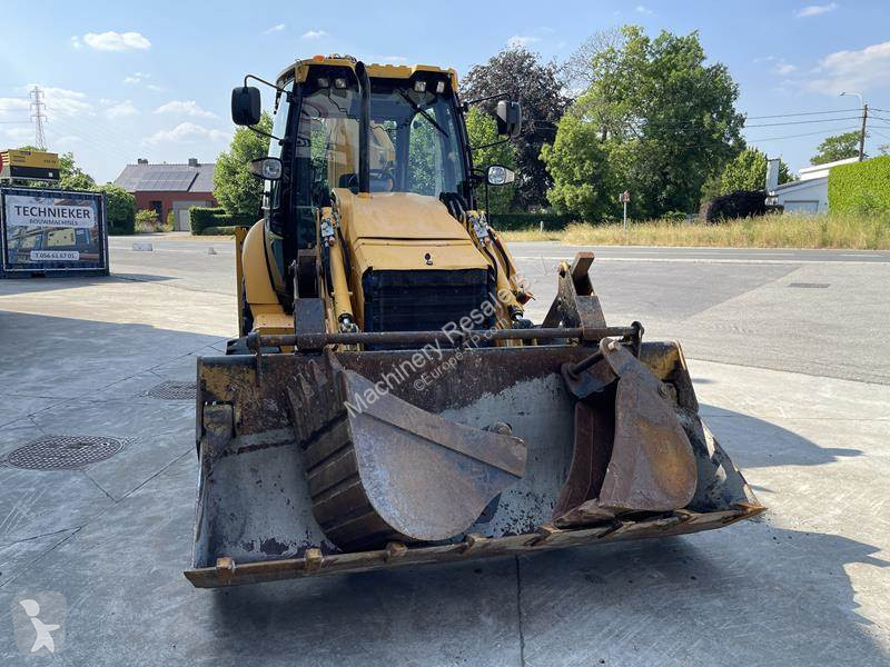Traktor med grab Caterpillar