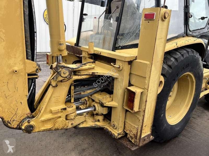 Traktor med grab Caterpillar
