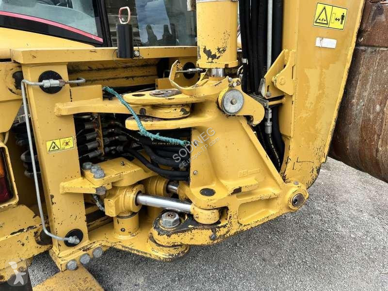 Traktor med grab Caterpillar