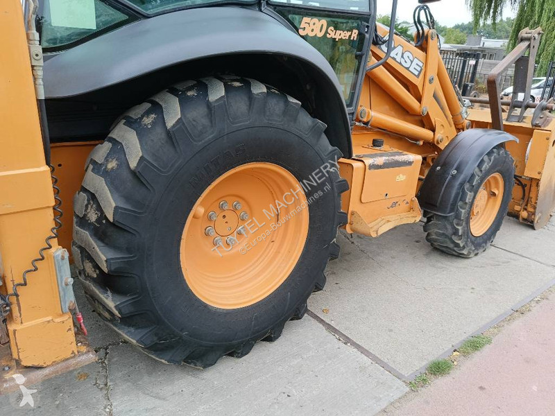 Traktor med grab Case backhoe loader graaf laad...