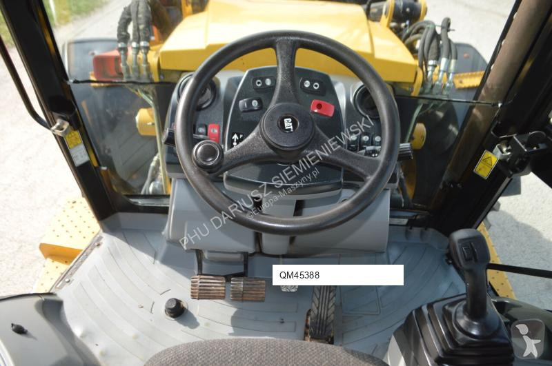 Traktor med grab Caterpillar 444F