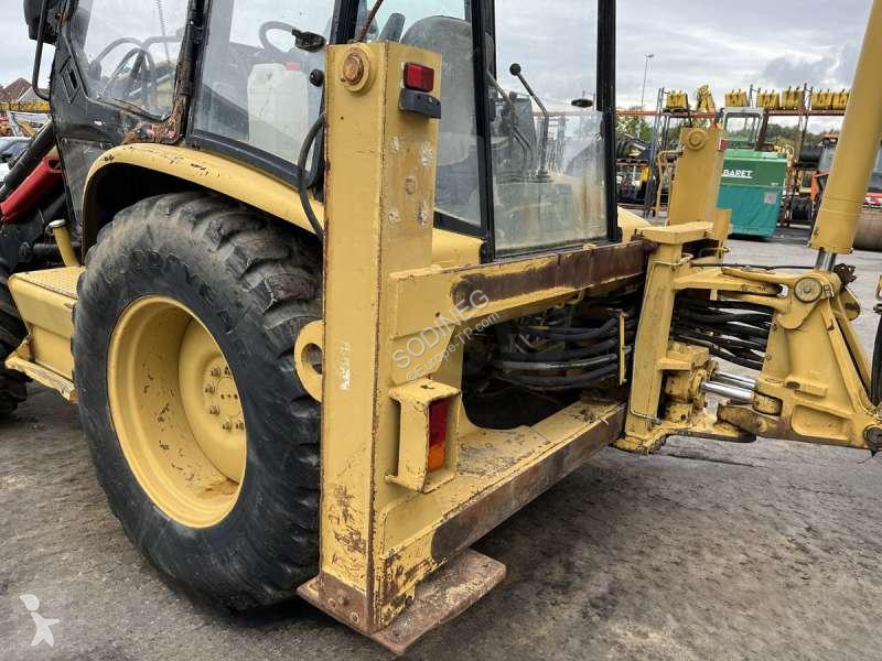 Traktor med grab Caterpillar