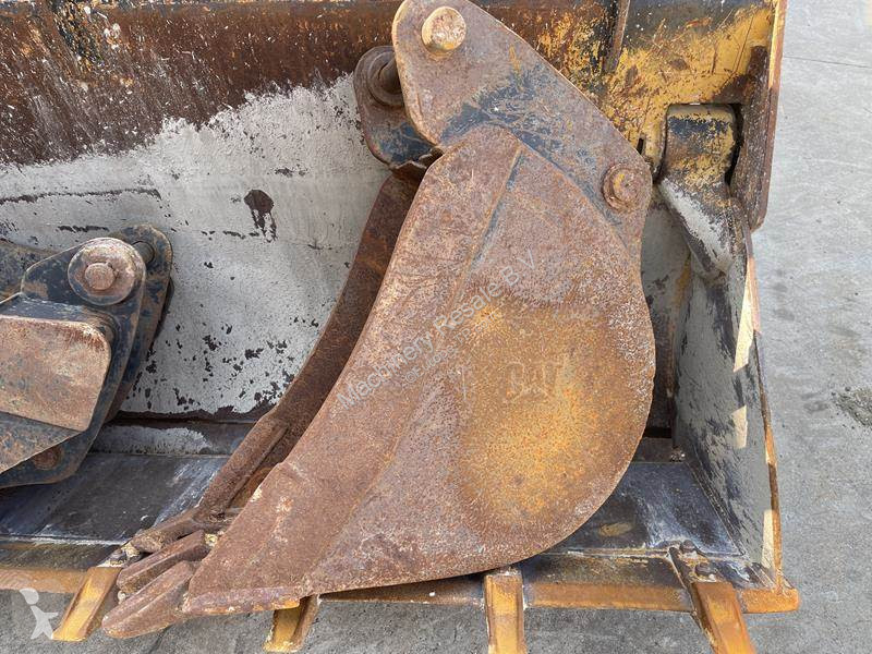 Traktor med grab Caterpillar