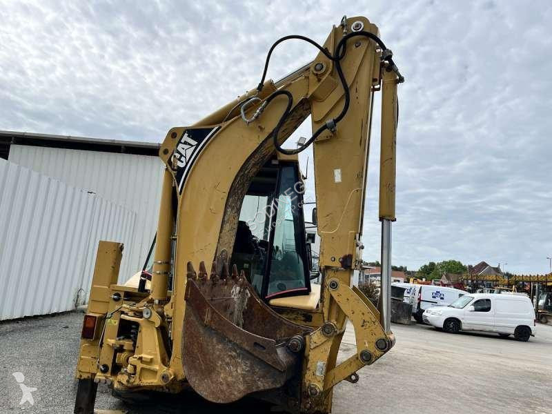 Traktor med grab Caterpillar