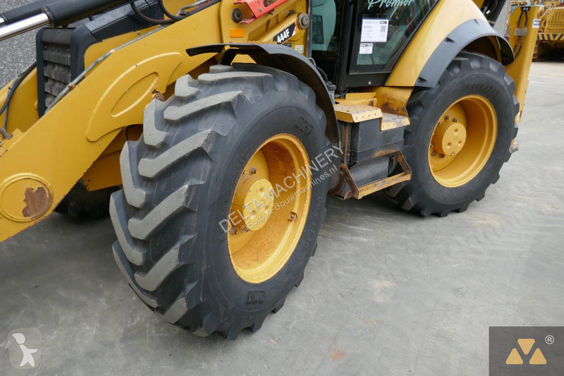 Traktor med grab Caterpillar 444F