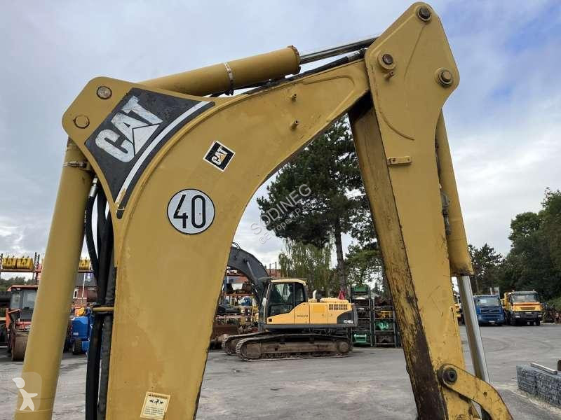 Traktor med grab Caterpillar