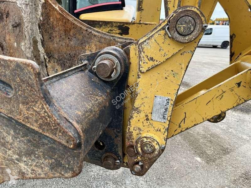 Traktor med grab Caterpillar