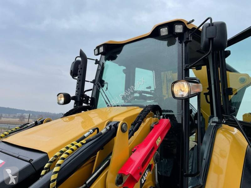 Traktor med grab Caterpillar 444 F2