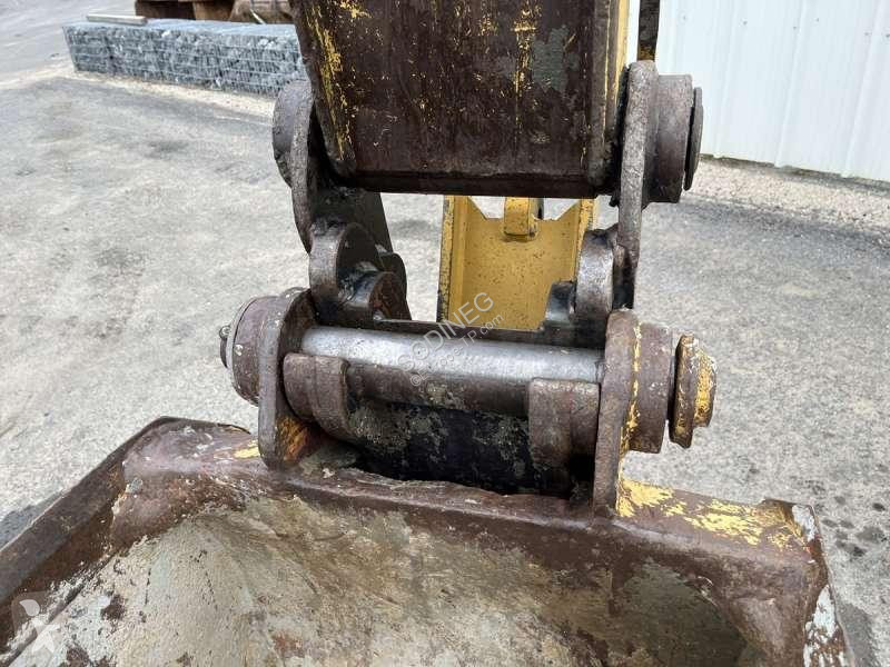 Traktor med grab Caterpillar