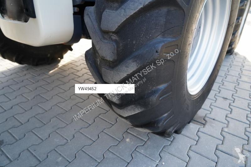 Traktor med grab Terex TLB 990