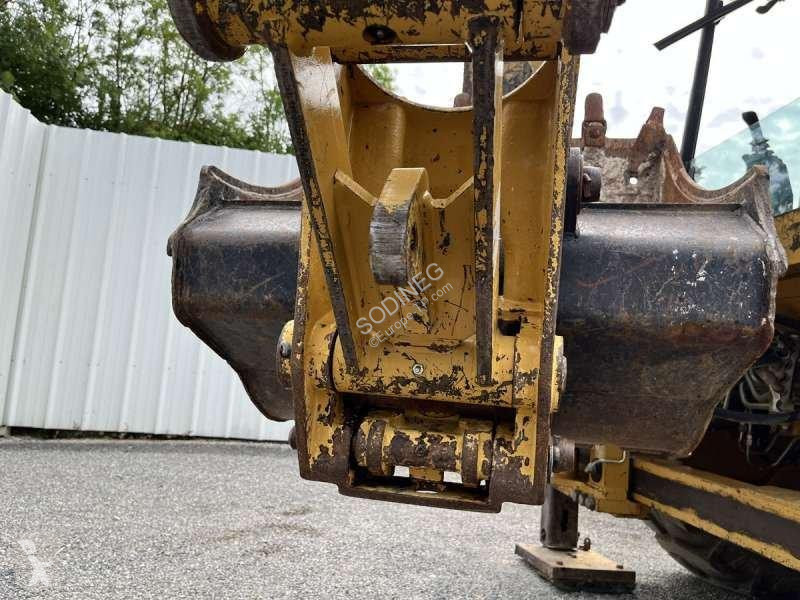 Traktor med grab Caterpillar