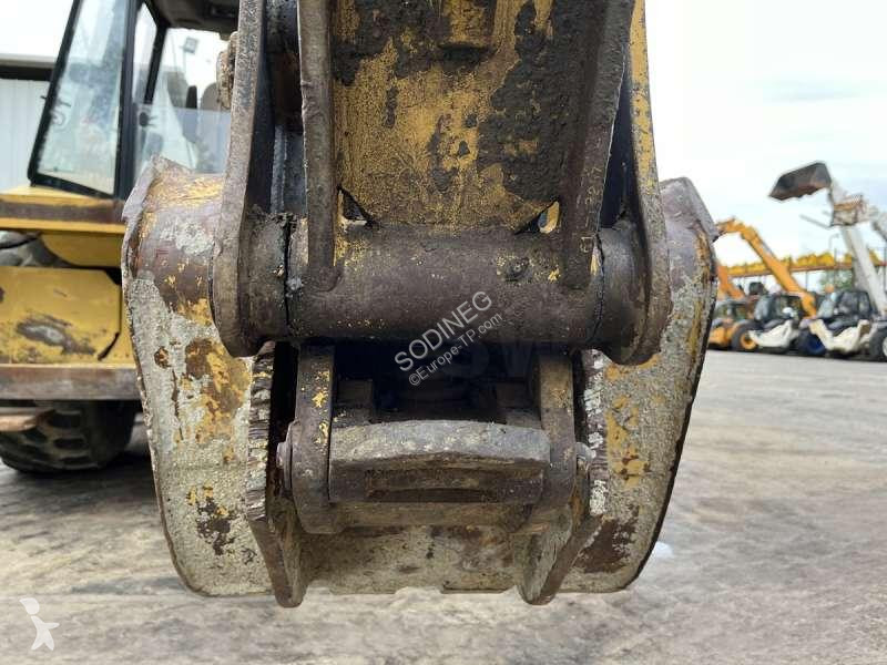 Traktor med grab Caterpillar