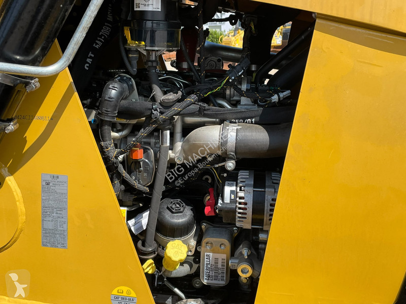 Traktor med grab Caterpillar 424