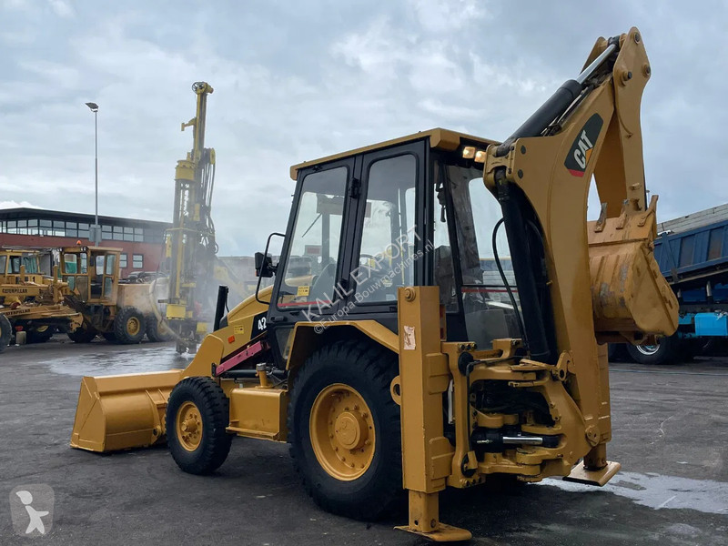 Traktor med grab Caterpillar 424B Backhoe...