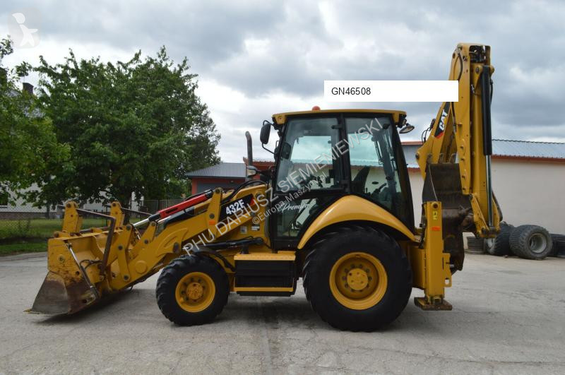 Traktor med grab Caterpillar