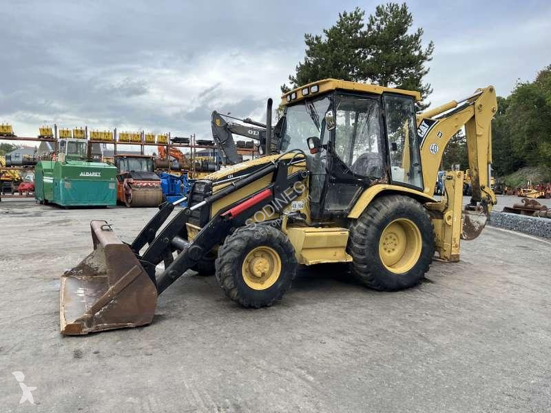 Traktor med grab Caterpillar
