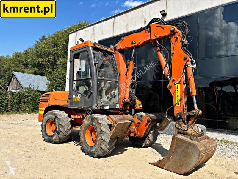 Traktor med grab Mecalac 12 MTX...