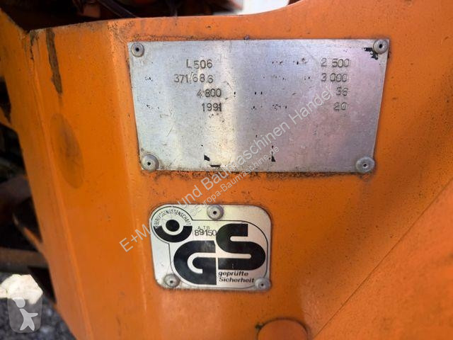 Traktor med grab Liebherr 506