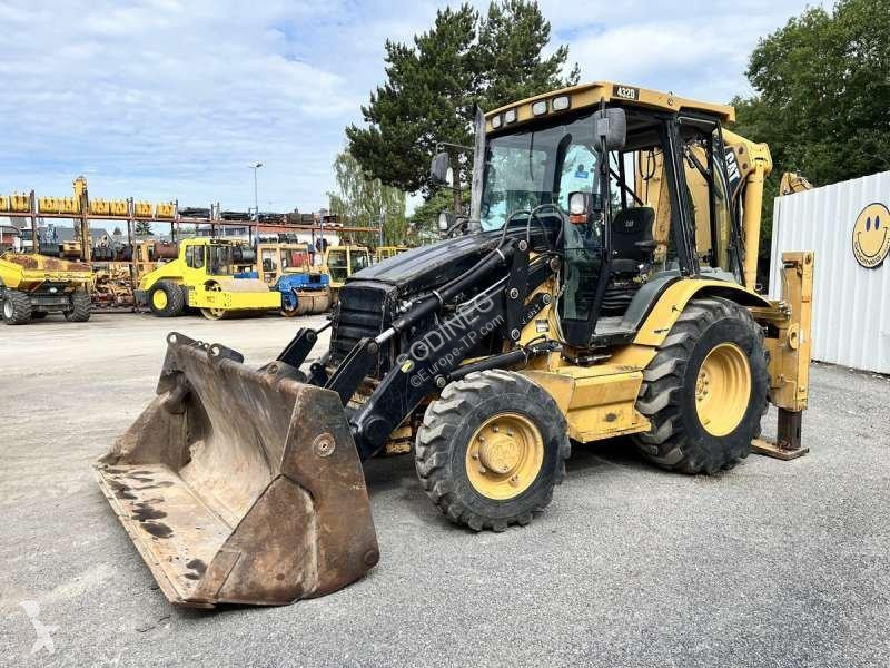 Traktor med grab Caterpillar
