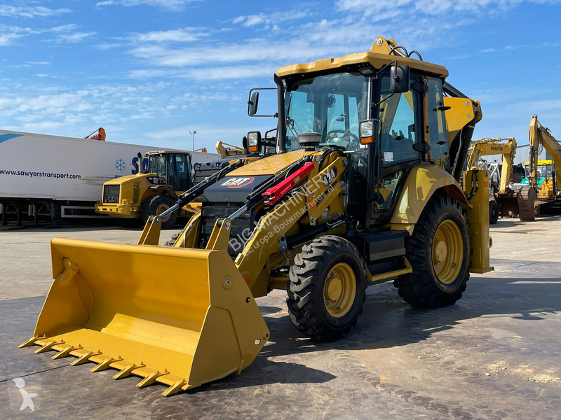 Traktor med grab Caterpillar 424