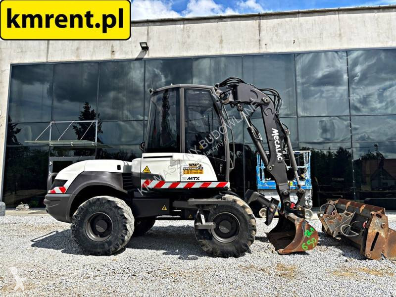 Koparko-ładowarka Mecalac 12 MTX...