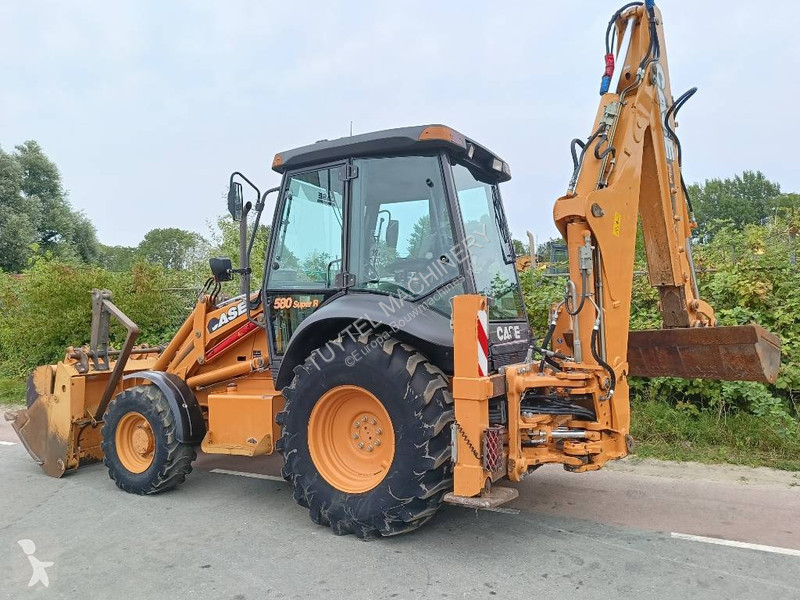 Traktor med grab Case backhoe loader graaf laad...