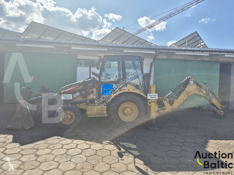 Екскаватор навантажувач Caterpillar